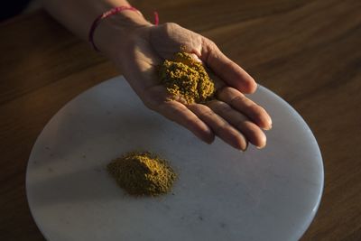 Turmeric in Kavita Khosa's hand